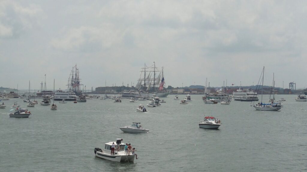 USS Costitution and USCG Eagle going up Fort Independence for 21 gun salute