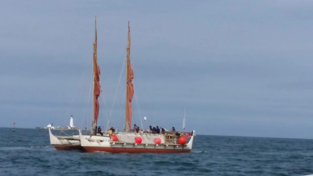 Hokulea with Boston light in the background